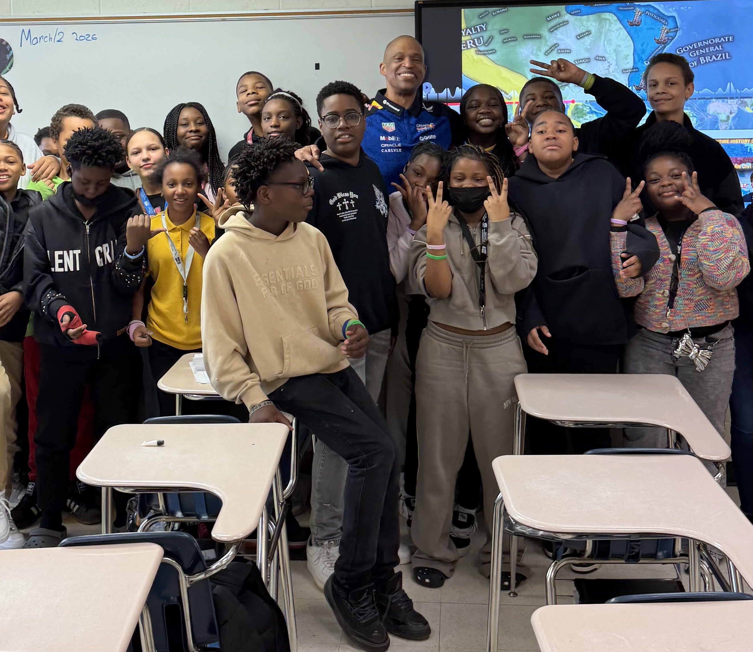 Ashaunte McLean speaking with students in a classroom